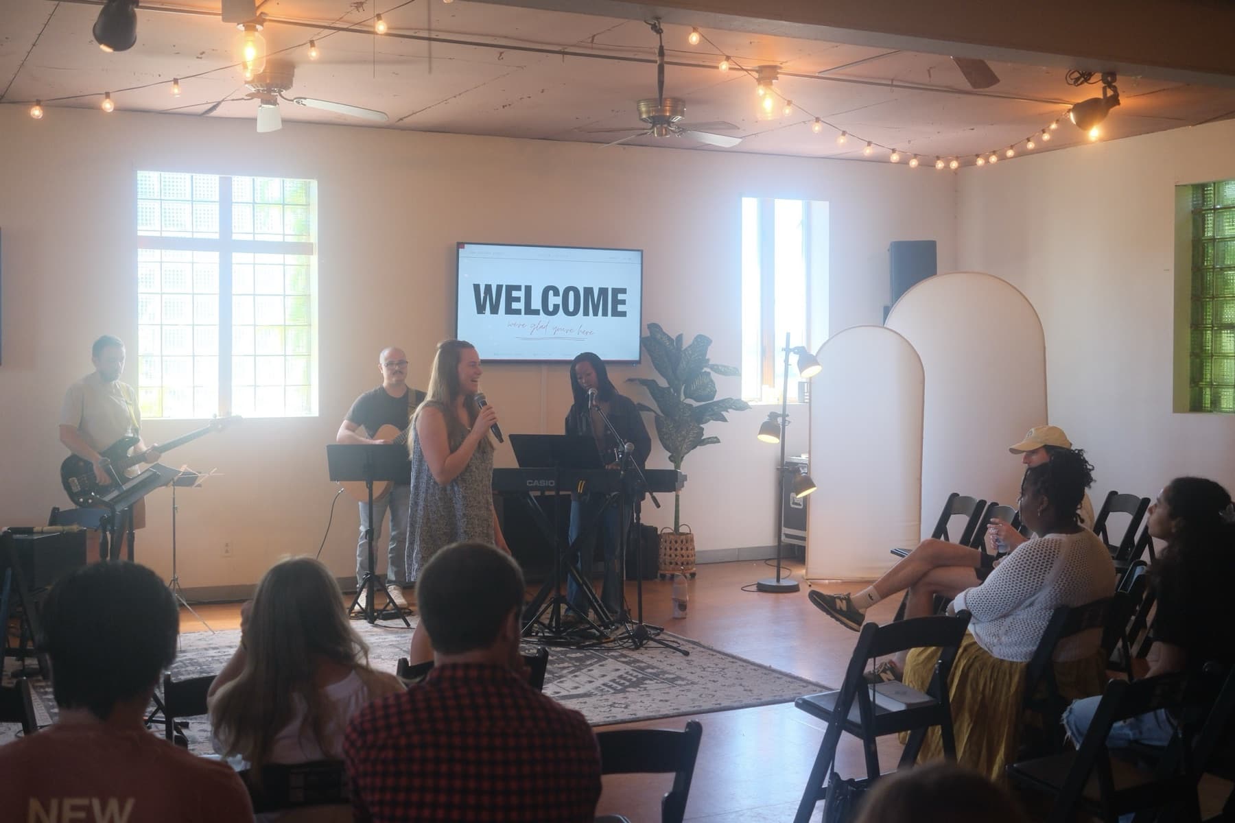 A New Culture Church host welcoming guests at the start of a Sunday gathering in Madison, WI